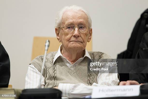 Oskar Groening arrives for the first day of his trial to face charges of being accomplice to the murder of 300,000 people at the Auschwitz...