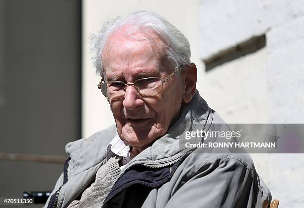 Former Nazi death camp officer Oskar Groening sits outside during a break of his trial on April 21, 2015 in Lueneburg, northern Germany. The...