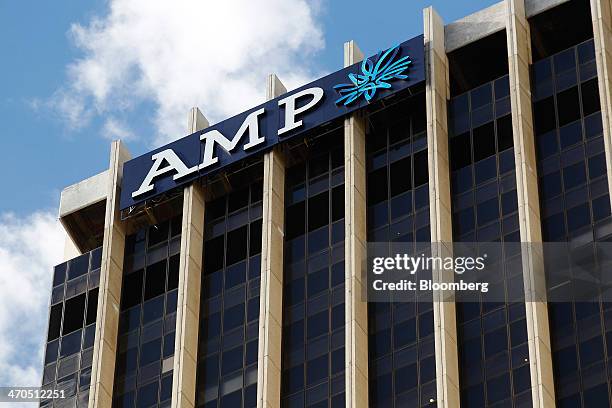 The logo of AMP Ltd. Is displayed atop the company's headquarters in Sydney, Australia, on Thursday, Feb. 20, 2014. AMP, Australias largest life...