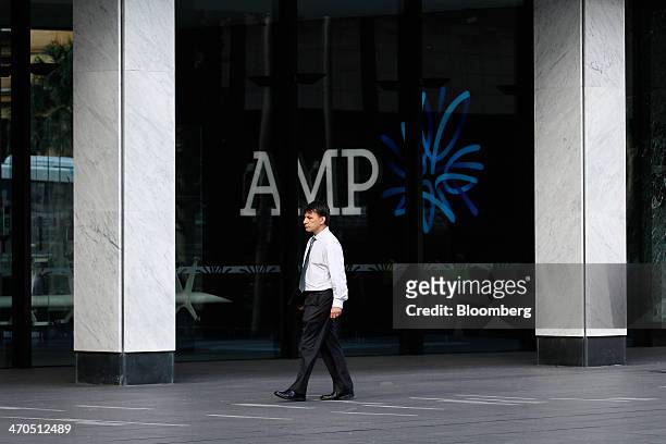 Man walks past AMP Ltd. Headquarters in Sydney, Australia, on Thursday, Feb. 20, 2014. AMP, Australias largest life insurer and fund manager, rose...