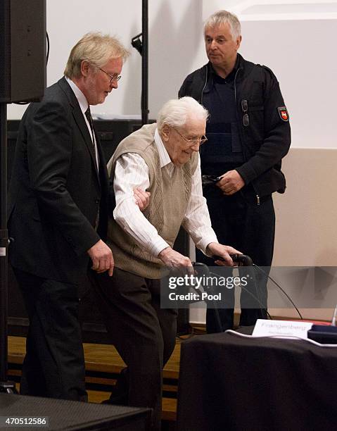 Oskar Groening and his lawyer Hans Holtermann arrive for the first day of his trial to face charges of being accomplice to the murder of 300,000...