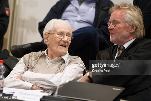 Oskar Groening and his lawyer Hans Holtermann are seen during the first day of his trial to face charges of being accomplice to the murder of 300,000...