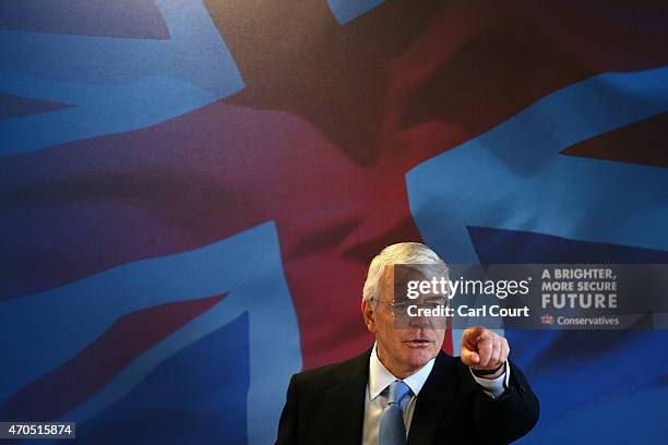 Former Conservative British Prime Minister John Major gestures during a speech on April 21, 2015 in Solihull, England. Major joined the election...