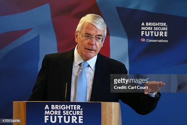 Former Conservative British Prime Minister John Major gestures during a speech on April 21, 2015 in Solihull, England. Major joined the election...