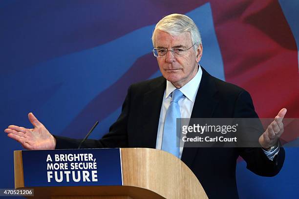 Former Conservative British Prime Minister John Major gestures during a speech on April 21, 2015 in Solihull, England. Major joined the election...