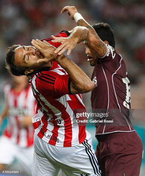 Leandro Desabato of Estudiantes receiving a foul from Victor Ayala of Lanus during a match between Estudiantes and Lanus as part of third round of...