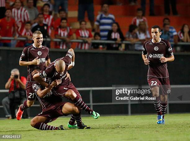 Santiago Silva of Lanus celebrates a scored goal with teammates during a match between Estudiantes and Lanus as part of third round of Torneo Final...