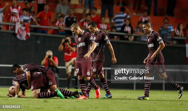 Santiago Silva of Lanus celebrates a scored goal with teammates during a match between Estudiantes and Lanus as part of third round of Torneo Final...
