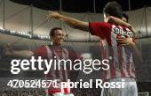 Guido Carrillo of Estudiantes celebrates with team mates after scoring the second goal of his team in a penalty kick during a match between...