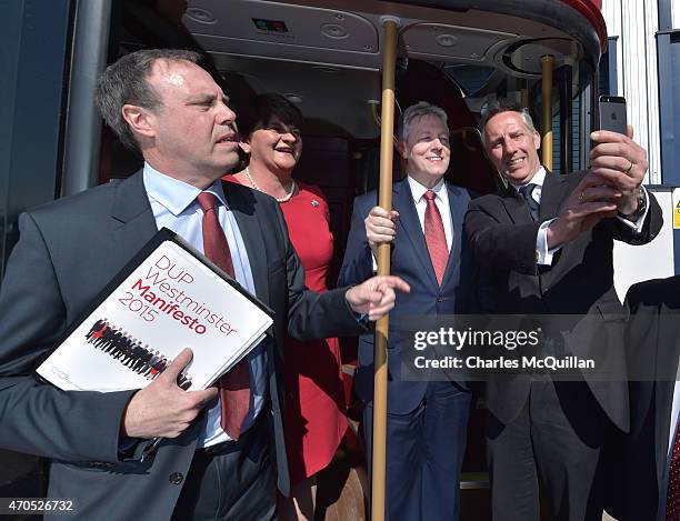 Ian Paisley Jr takes a selfie with Northern Ireland First Minister and DUP leader Peter Robinson alongside Nigel Dodds and Arlene Foster at the...