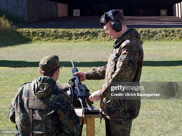 First practice shooting of the new recruits with the rifle G36 and live ammunition at the tank battalion 203 in Augustdorf. Trainer instructs a...