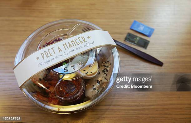 Korean chicken salad sits on a customer's table inside a Pret A Manger sandwich store, operated by private equity firm Bridgepoint, in London, U.K.,...