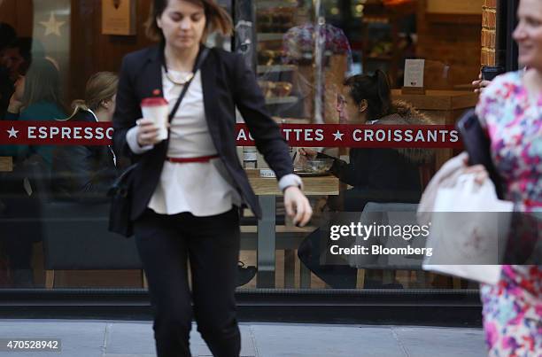 Customers sit at a table inside a Pret A Manger sandwich store, operated by private equity firm Bridgepoint, in London, U.K., on Tuesday, April 21,...