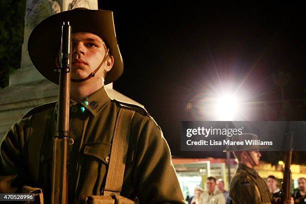 Members of the '9th Battalion AIF Living History Unit' from Rockhampton stand in silence during a wreath laying ceremony on April 21, 2015 in...