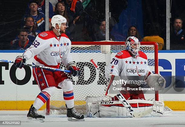 Mike Green and Braden Holtby of the Washington Capitals skate against the New York Islanders in Game Three of the Eastern Conference Quarterfinals...