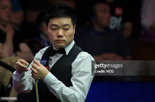 Ding Junhui of China looks on in his match against Mark Davies of England during day four of the 2015 Betfred World Snooker Championship at Crucible...