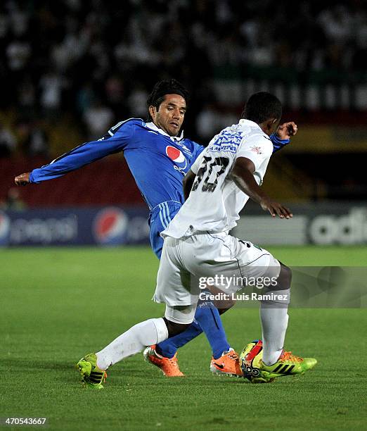 Fabian Vargas of Millonarios struggles for the ball with Gustavo Culma of Once Caldas during a match between Millonarios and Once Caldas as part of...