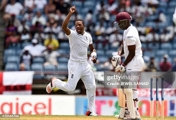 England's cricketer Chris Jordan celebrates dismissing West Indies batsman Devon Smith during the second Test match between West Indies and England...