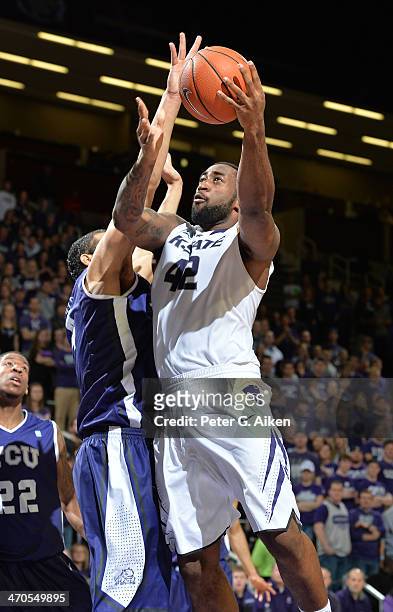 Forward Thomas Gipson of the Kansas State Wildcats drives in for a basket against the TCU Horned Frogs during the second half on February 19, 2014 at...