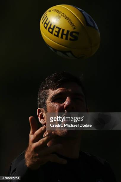 Quinten Lynch marks the ball during a Collingwood Magpies AFL training session at Olympic Park on February 20, 2014 in Melbourne, Australia.