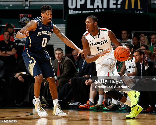 Davon Reed of the Miami Hurricanes starts to the basket against Eric Atkins of the Notre Dame Fighting Irish on February 19, 2014 at the BankUnited...