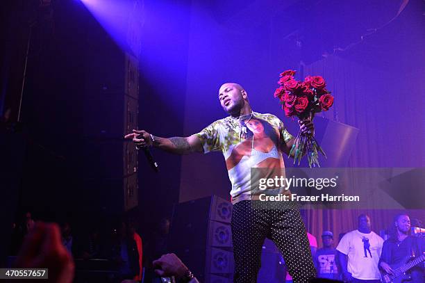 Flo Rida performs at Club SI Swimsuit hosted by Sports Illustrated at LIV Nightclub at Fontainebleau Miami Beach on February 19, 2014 in Miami Beach,...