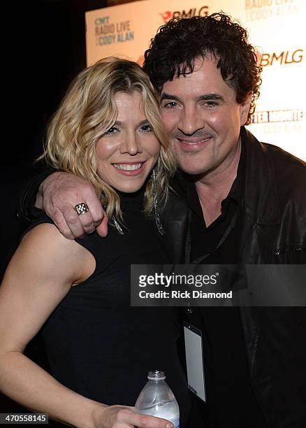 The Band Perry's Kimberly Perry and Big Machine Label Group President & CEO Scott Borchetta pause for a photo backstage at the 2014 Big Machine Label...