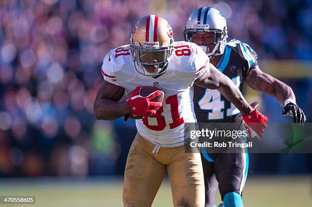 Anquan Boldin of the San Francisco 49ers runs the ball during the NFC Divisional Playoff Game against the Carolina Panthers at Bank of America...