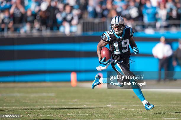 Ted Ginn of the Carolina Panthers runs the ball during the NFC Divisional Playoff Game against the San Francisco 49ers at Bank of America Stadium on...