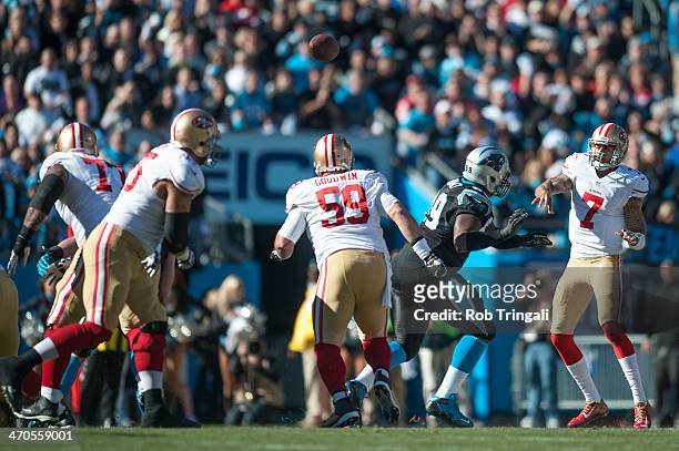 Colin Kaepernick of the San Francisco 49ers makes a pass during the NFC Divisional Playoff Game against the Carolina Panthers at Bank of America...