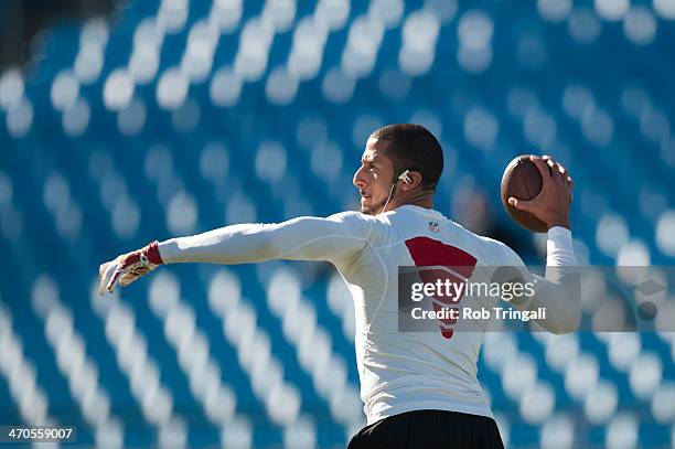 Colin Kaepernick of the San Francisco 49ers warms up before the NFC Divisional Playoff Game against the Carolina Panthers at Bank of America Stadium...