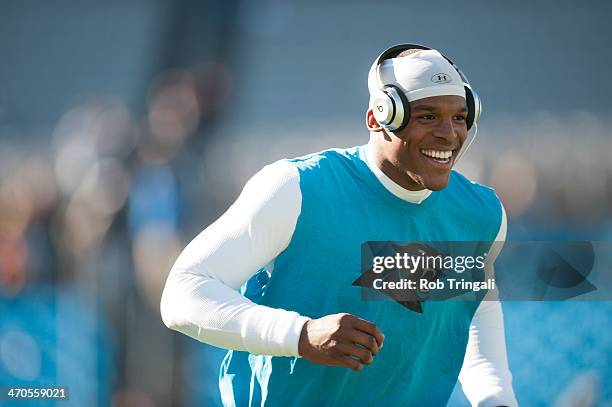 Cam Newton of the Carolina Panthers warms up before the NFC Divisional Playoff Game against the San Francisco 49ers at Bank of America Stadium on...