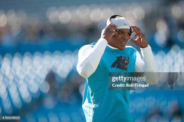 Cam Newton of the Carolina Panthers warms up before the NFC Divisional Playoff Game against the San Francisco 49ers at Bank of America Stadium on...