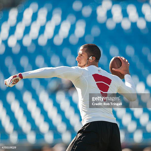 Colin Kaepernick of the San Francisco 49ers warms up before the NFC Divisional Playoff Game against the Carolina Panthers at Bank of America Stadium...