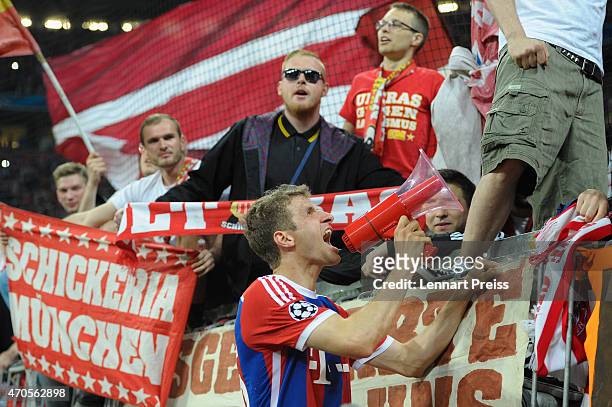 Thomas Mueller of Munich celebrates with the fans after the UEFA Champions League quarter final second leg match between FC Bayern Muenchen and FC...