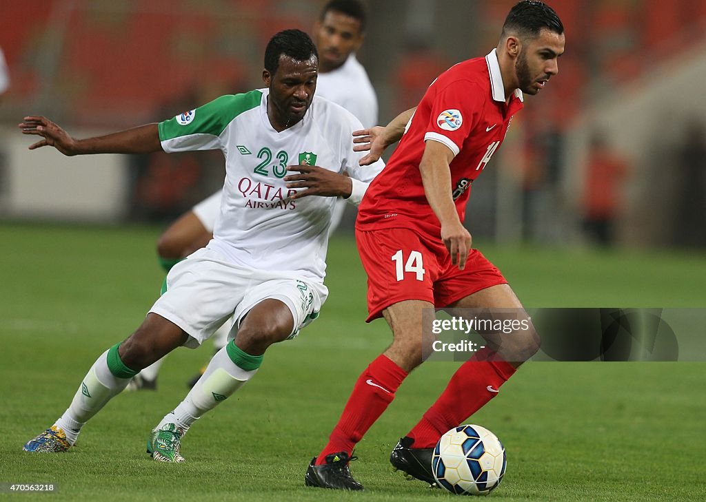 Saudi Arabia's AlAhli SC defender Kamil alMousa vies with Dubai's... News Photo Getty Images Saudi Arabia's AlAhli SC defender Kamil alMousa vies with Dubai's... News Photo Getty Images