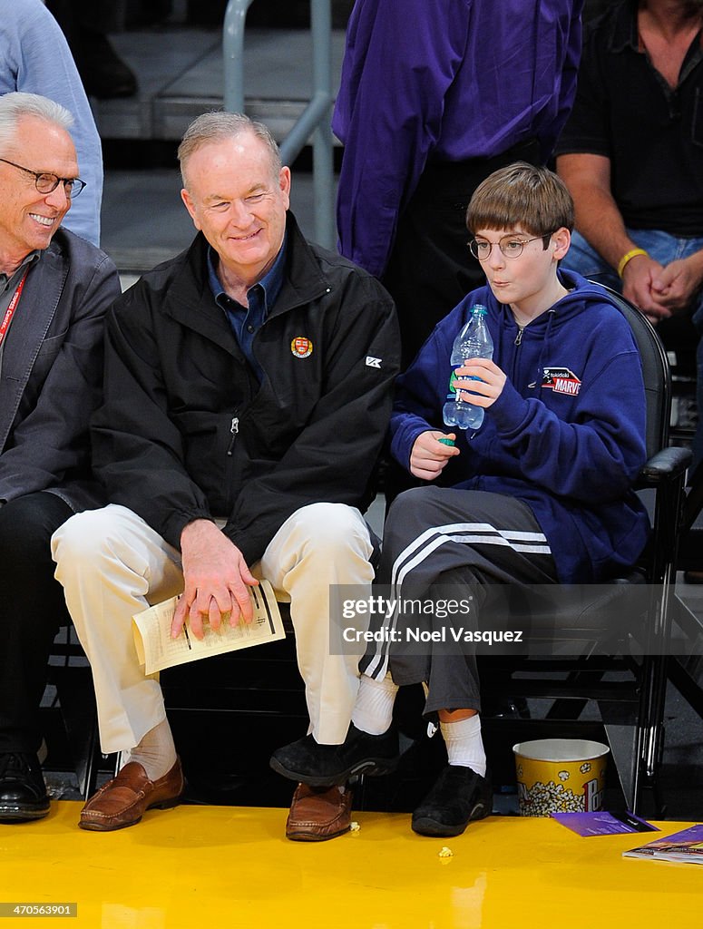 Bill O'Reilly and his son Spencer O'Reilly attend a basketball game