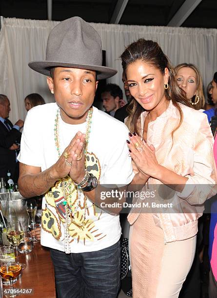 Pharrell Williams and Nicole Scherzinger attend The BRIT Awards 2014 Sony after party on February 19, 2014 in London, England.