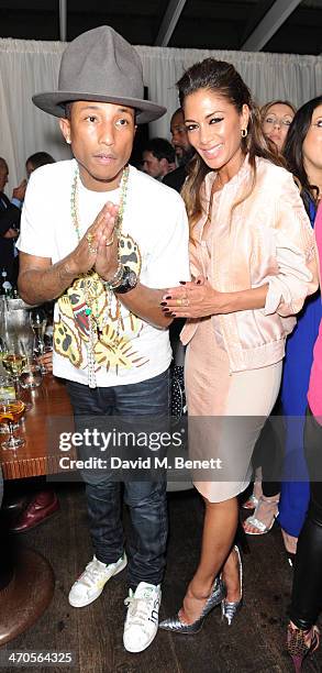 Pharrell Williams and Nicole Scherzinger attend The BRIT Awards 2014 Sony after party on February 19, 2014 in London, England.