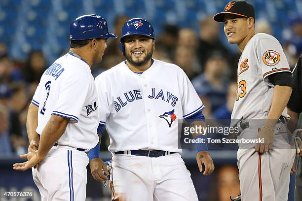 Dioner Navarro of the Toronto Blue Jays reacts after hitting a double in the second inning and advancing to third base during MLB game action as...