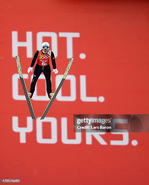 Akito Watabe of Japan performs a trial jump ahead of the Nordic Combined Men's Team LH during day 13 of the Sochi 2014 Winter Olympics at RusSki...