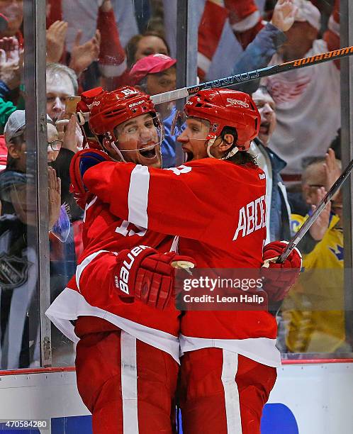 Riley Sheahan of the Detroit Red Wings celebrates after scoring a power play goal with teammate Justin Abdelkader during the third period in Game...