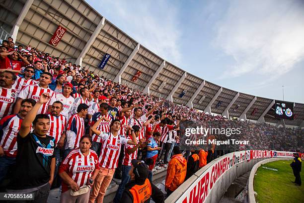 Fans of Chivas cheer for their team during a Championship match between Puebla and Chivas as part of Copa MX Clausura 2015 at Olimpico Universitario...