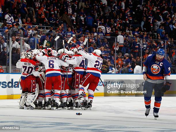 The Washington Capitals celebrate the game winning overtime goal at 11:09 of the first overtime period by Nicklas Backstrom against the New York...