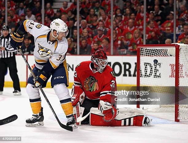 Colin Wilson of the Nashville Predators scores a goal on a deflection against Scott Darling of the Chicago Blackhawks in Game Four of the Western...