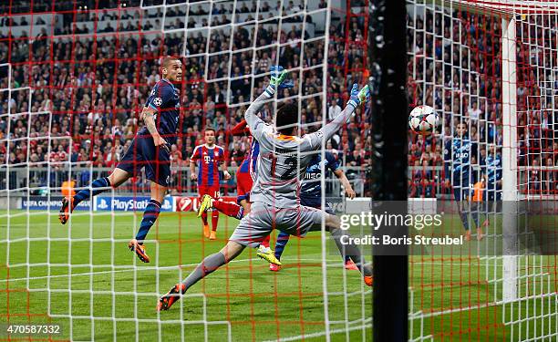 Thiago Alcantara of Bayern Muenchen scores his team's first goal during the UEFA Champions League Quarter Final Second Leg match between FC Bayern...