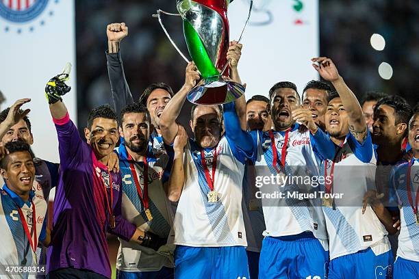 Cuauhtemoc Blanco of Puebla holds the trophy after winning the Championship match between Puebla and Chivas as part of Copa MX Clausura 2015 at...