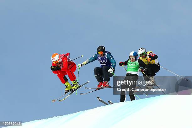 Armin Niederer of Switzerland leads from Scott Kneller of Australia during the Freestyle Skiing Men's Ski Cross 1/8 Finals on day 13 of the 2014...