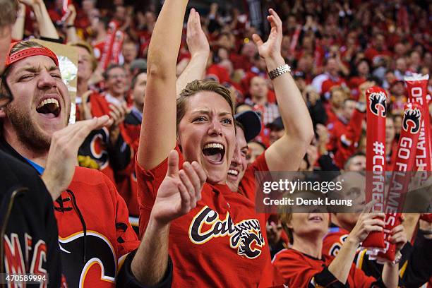 Fans of the Calgary Flames celebrate after a goal against the Vancouver Canucks in Game Four of the Western Quarterfinals during the 2015 NHL Stanley...