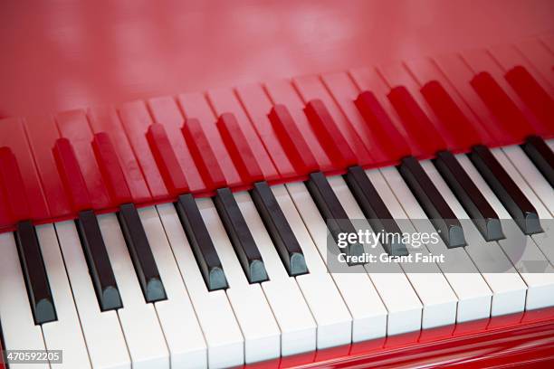 close up red piano - keyboard instrument stock pictures, royalty-free photos & images